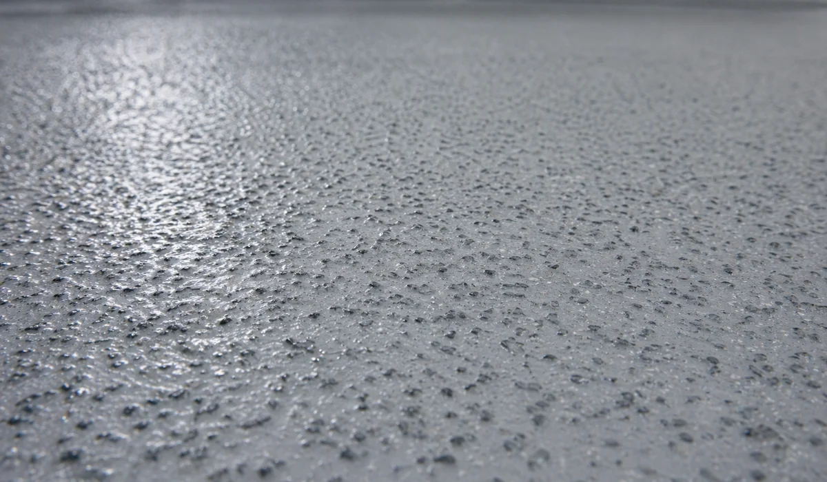 Close-up of hygienic PU flooring surface with R12 aggregate detail